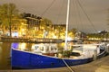 Beautiful landscape with boats on the canal in the evening Amsterdam