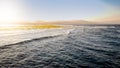 Beautiful landscape of calm ocean and the mountains on the coast. Sea waves rolling and braking over dead coral reef and Royalty Free Stock Photo