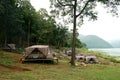 Camping tents at outdoor camp site near the river Royalty Free Stock Photo