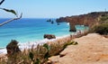 Beautiful landscape: cliffs in turquoise Atlantic ocean near beach Praia Dona Ana, Lagos, Portugal Royalty Free Stock Photo