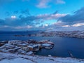 Beautiful landscape of a coastal small town among snowy mountains in Norway Royalty Free Stock Photo