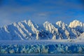 Beautiful landscape. Cold sea water. Land of ice. Travelling in Arctic Norway. White snowy mountain, blue glacier Svalbard, Norwa