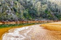 Beautiful landscape with colorful river, trees and cracked earth. River Odiel, Andalucia, Spain