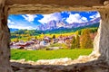 Beautiful landscape of Cortina d` Ampezzo in Dolomites Alps view through stone window Royalty Free Stock Photo