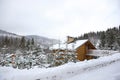 Landscape with cottage on snowy winter day Royalty Free Stock Photo