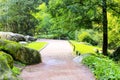 Beautiful landscape design in the park - orange walkway, green trees and picturesque stones, alley in Park, Uman