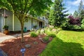 Beautiful landscape design with sawdust flower bed and lawn