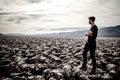 beautiful landscape of Devil's golf course in death valley with young manr walking at sunset Royalty Free Stock Photo