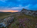 Beautiful landscape and a dramatic sunset sky with storm clouds over Enisala old stronghold citadel Royalty Free Stock Photo