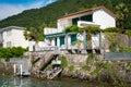 Scenic view of the villas in traditional village of Brusino Arsizio on the shore of Lake Lugano, in Switzerland.