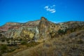 Beautiful landscape with fabulous mountain-like rocks and houses and churches near from the village of Cavusin. Cappadocia, Turkey Royalty Free Stock Photo