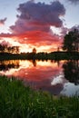 Beautiful landscape with fiery sunset over the lake Royalty Free Stock Photo