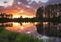 Beautiful landscape with fiery sunset over the lake Royalty Free Stock Photo