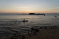 The beautiful landscape of fishing boat floating on sea with sunset blackground,thailand Royalty Free Stock Photo