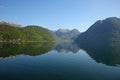 Beautiful landscape in the fjord, with reflections of the mountains in the water. Rosendal, Hardangerfjord, Norway. Royalty Free Stock Photo