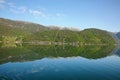 Beautiful landscape in the fjord, with reflections of the mountains in the water. Rosendal, Hardangerfjord, Norway. Royalty Free Stock Photo