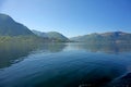 Beautiful landscape in the fjord, with reflections of the mountains in the water. Rosendal, Hardangerfjord, Norway. Royalty Free Stock Photo