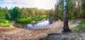 Beautiful Landscape of forest river with reflections of clouds and trees.