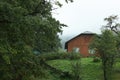 Beautiful landscape with forest and wooden house in mountains Royalty Free Stock Photo