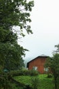 Beautiful landscape with forest and wooden house in mountains Royalty Free Stock Photo