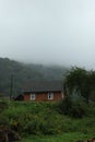 Beautiful landscape with forest and wooden houses in mountains Royalty Free Stock Photo