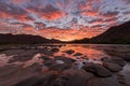 A beautiful landscape of a golden sunset over the mountains and river Royalty Free Stock Photo