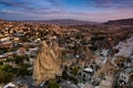 Beautiful landscape of Goreme on sunrise.Cappadocia.Turkey. View of rock formations fairy chimneys, hotels and houses at the cave. Royalty Free Stock Photo