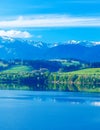 Beautiful landscape, green meadow and lake with mountain in background. Slovakia, Central Europe. Royalty Free Stock Photo