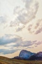 Beautiful landscape with green mountains and magnificent cloudy sky in sunset. Royalty Free Stock Photo