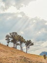 Beautiful landscape with green mountains and magnificent cloudy sky in sunset. Royalty Free Stock Photo