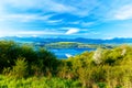 Beautiful landscape, green and yellow meadow and lake with mountain in background. Slovakia, Central Europe. Royalty Free Stock Photo