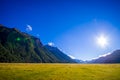 Beautiful landscape of high mountain glacier at milford sound with a sunshine in the sky, in south island in New Zealand Royalty Free Stock Photo