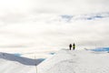 Beautiful landscape with hikers on a snowy summit in South Tyrol, Dolomites, Italy