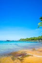 Beautiful landscape of Hon Thom beach, Phu Quoc island, Vietnam, Asia with tourist, chairs and umbrella. White sand and coco palms Royalty Free Stock Photo