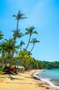 Beautiful landscape of Hon Thom beach, Phu Quoc island, Vietnam, Asia with tourist, chairs and umbrella. White sand and coco palms Royalty Free Stock Photo