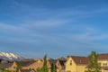 Beautiful landscape of houses with snow capped mountain and vibrant sky view Royalty Free Stock Photo