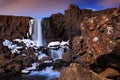 Beautiful landscape from Iceland. ÃâxarÃÂ¡rfoss waterfall before sunrise. Water in the rock. Winter scene with snow, stone and Royalty Free Stock Photo