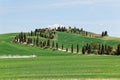 Beautiful landscape of idyllic Tuscany countryside in springtime, with a winding country road lined with cypress trees Royalty Free Stock Photo