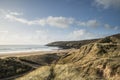Beautiful landscape image of Freshwater West beach with sand dun