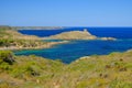 View on the light house Cape Favaritx and the old watch tower Es Colomar in Es Grau on Menorca