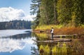 Beautiful landscape of a lake in a forest and fishing man. Rolley Lake Provincial Park near the town of Mission in BC