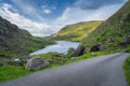 Beautiful landscape with lake, green hills and winding road in Gap of Dunloe, Black Valley Royalty Free Stock Photo