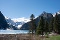 Beautiful landscape with Lake Louise and snowed mountains around. Spring at Banff National Park, Alberta, Canada. Royalty Free Stock Photo