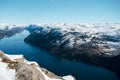 Beautiful landscape of lake, river, sea with the rocky shore with mountains with snowy peaks. Top view of the Pulpit