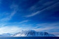 Beautiful landscape. Land of ice. Cold blue water nature. Rocky island with snow. White snowy mountain, blue glacier Svalbard, Nor