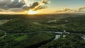 Beautiful landscape of lush green vegetation and a tranquil river with a bridge. Pago Bay, Guam.