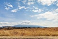 Beautiful landscape with Mount Fuji with snow and hat shaped cloud. Horizontal shot Royalty Free Stock Photo