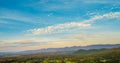 Beautiful landscape mountain green field grass meadow white cloud blue sky on sunny day. Majestic green scenery big mountain hill Royalty Free Stock Photo