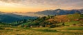 Beautiful landscape mountain hill meadow sunrise morning village Bucovina Romania