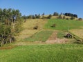 Beautiful landscape of mountain Kopaonik in Serbia, small house on green field, rural scene, majestic pitoresque view. Royalty Free Stock Photo